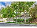 Charming single-story home exterior with mature trees and manicured landscaping at 4419 Via Bianca Ave, Las Vegas, NV 89141