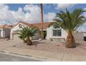 Street view of single-story home with desert landscaping and a classic terra cotta roof at 517 Scenic Terra Dr, Henderson, NV 89015