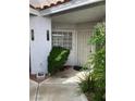 A welcoming home entrance with desert landscaping and security door at 5201 S Torrey Pines Dr # 1253, Las Vegas, NV 89118
