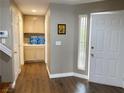 Open foyer featuring wood floors, natural light, and easy access to the home's amenities at 5201 S Torrey Pines Dr # 1253, Las Vegas, NV 89118