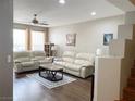 Bright living room with a ceiling fan and wood floors at 5201 S Torrey Pines Dr # 1253, Las Vegas, NV 89118