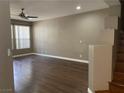 Spacious living room features wood laminate flooring and plenty of natural light at 5201 S Torrey Pines Dr # 1253, Las Vegas, NV 89118
