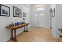 Bright entryway features tiled floor, high ceilings, and natural light from the transom window at 5812 Spinnaker Reach Ave, Las Vegas, NV 89130