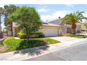 Charming single-story home features a well-manicured lawn and a two-car garage at 7617 Sea Cliff Way, Las Vegas, NV 89128