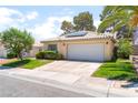 Charming single-story home features a well-manicured lawn and a two-car garage at 7617 Sea Cliff Way, Las Vegas, NV 89128