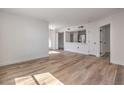 Bright living room and kitchen area features hardwood floors, stainless steel appliances, and natural light at 8101 W Flamingo Rd # 1035, Las Vegas, NV 89147