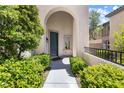 Inviting front entrance with lush landscaping at 820 Colina Alta Pl, Las Vegas, NV 89138
