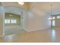Spacious living room with ceramic tile flooring and archways leading to other rooms at 8204 Turbys Treehouse Pl, Las Vegas, NV 89131
