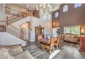 Elegant living room with high ceilings, staircase and dining area at 11219 Playa Bonita Ave, Las Vegas, NV 89138