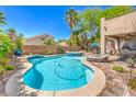 Backyard pool with jacuzzi and shaded patio at 11219 Playa Bonita Ave, Las Vegas, NV 89138