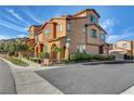 Corner lot featuring a two-story home with a landscaped area and a detached garage at 11420 Ogden Mills Dr # 101, Las Vegas, NV 89135