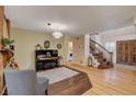 Comfortable living room featuring a piano, elegant staircase, and stylish decor at 1700 Red Rock St, Las Vegas, NV 89146