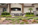 Elegant signage 'Resort Villas' amid landscaped grounds, complemented by lush greenery and manicured shrubs at 2050 W Warm Springs Rd # 4211, Henderson, NV 89014