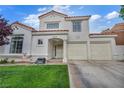 Charming stucco home with terracotta roof, well-kept lawn, and two-car garage in a sunny suburban neighborhood at 2124 Rising Mist St, Las Vegas, NV 89134