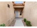 Inviting entryway with neutral walls, tile flooring, and a security screen front door at 2231 Hallston St, Las Vegas, NV 89134