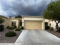 Single-story home featuring a two-car garage and a neutral color palette at 2231 Hallston St, Las Vegas, NV 89134