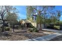 Well-maintained home with desert landscaping and a spacious driveway near the Rimbaud street sign at 2737 Rimbaud St, Henderson, NV 89044