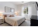 Cozy bedroom with plush carpet, neutral tones, and natural light creates a serene and comfortable space at 3218 Mura Del Prato Ave, Henderson, NV 89044