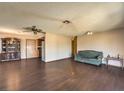 Traditional living room features dark wood floors and a decorative china cabinet at 403 Woodridge Dr, Henderson, NV 89015