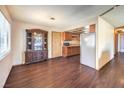 Open floor plan connecting the dining area, living room and kitchen at 403 Woodridge Dr, Henderson, NV 89015