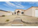 Single-story home featuring desert landscaping, a two-car garage and a private walkway at 434 Viewmont Dr, Henderson, NV 89015