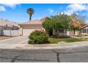 Charming single-story home with desert landscaping and a two-car garage at 4517 Rodman Dr, Las Vegas, NV 89130