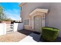 Charming front entrance with secure gate and meticulously maintained landscaping, exuding curb appeal at 4608 Snake Eyes St # 102, Las Vegas, NV 89122