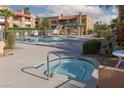 View of the community jacuzzi surrounded by mature landscaping and the community pool at 5114 S Jones Blvd # 202, Las Vegas, NV 89118