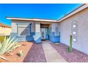 Inviting entryway with a decorative glass door, complemented by a well-maintained front yard at 52 Vallejo Verde St, Henderson, NV 89012