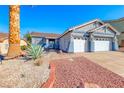 Inviting single-story home featuring a low maintenance yard, complemented by a two-car garage at 52 Vallejo Verde St, Henderson, NV 89012