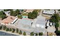 Large lot featuring a house, oversized garage, solar panels, storage buildings, and additional parking at 5202 Willis St, North Las Vegas, NV 89031