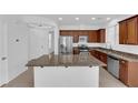 Charming kitchen featuring stainless steel appliances, granite countertops and tiled floors with natural light at 5960 Addy Ln, North Las Vegas, NV 89081
