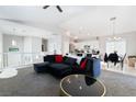 Bright living room featuring vaulted ceilings and an open floor plan with modern furnishings at 7047 Sombra Way, Las Vegas, NV 89113