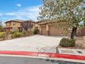 Charming two-story home with desert landscaping and a large three-car garage at 7505 Java Sparrow St, North Las Vegas, NV 89084