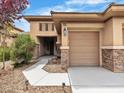 Charming home featuring desert landscaping and a quaint covered entryway leading up to the front door at 7505 Java Sparrow St, North Las Vegas, NV 89084