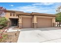 A warm and inviting home with an attached two-car garage, with meticulous landscaping at 7505 Java Sparrow St, North Las Vegas, NV 89084