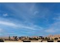 Breathtaking view of the Las Vegas skyline against a beautiful blue sky backdrop and mountain range at 8113 Misty Canyon Ave, Las Vegas, NV 89113