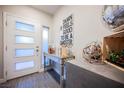 Modern entryway featuring sleek console table and striking decor at 8113 Misty Canyon Ave, Las Vegas, NV 89113