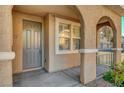 Close-up of the front entryway, showcasing a sturdy door and pleasant architectural details at 8409 Insignia Ave # 102, Las Vegas, NV 89178
