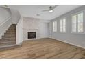 Spacious living room featuring beautiful flooring, a cozy fireplace, and natural light at 8409 Insignia Ave # 102, Las Vegas, NV 89178