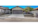 Charming home with a two-car garage, low maintenance landscaping, and a tidy yard at 8412 Mulcahy Ave, Las Vegas, NV 89145