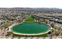 Aerial view of the community's serene lake and surrounding residential area at 87 Serene Tempo Ave, Henderson, NV 89011