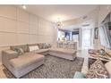 Stylish living space with modern decor, open to the kitchen for seamless entertaining at 91 E Agate Ave # 204, Las Vegas, NV 89123