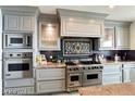 Gourmet kitchen features stainless steel appliances, custom cabinets, and a decorative backsplash at 9101 Alta Dr # 507, Las Vegas, NV 89145