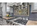 Gourmet kitchen features stainless steel appliances, custom cabinets, and a decorative backsplash at 9101 Alta Dr # 507, Las Vegas, NV 89145