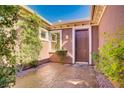 Welcoming front entrance with decorative stone walkway and well-maintained landscaping around the front door at 936 Viscanio Pl, Las Vegas, NV 89138