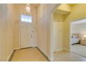 Inviting foyer with a pendant light and tile flooring, leading into the bedroom on the right at 9524 Tyler Rose St, Las Vegas, NV 89178