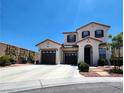 Attractive two-story home with a double garage and well-manicured front yard in a suburban setting at 11201 Newbury Hills Ave, Las Vegas, NV 89138