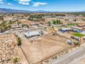 Expansive aerial view of the property highlighting the home's placement on a large lot with mountain views at 1410 Tiptop Trl, Pahrump, NV 89048