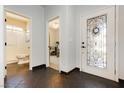 Inviting entryway featuring decorative tile flooring, a stylish front door, and access to other rooms at 145 Austin Rose Ave, Henderson, NV 89002